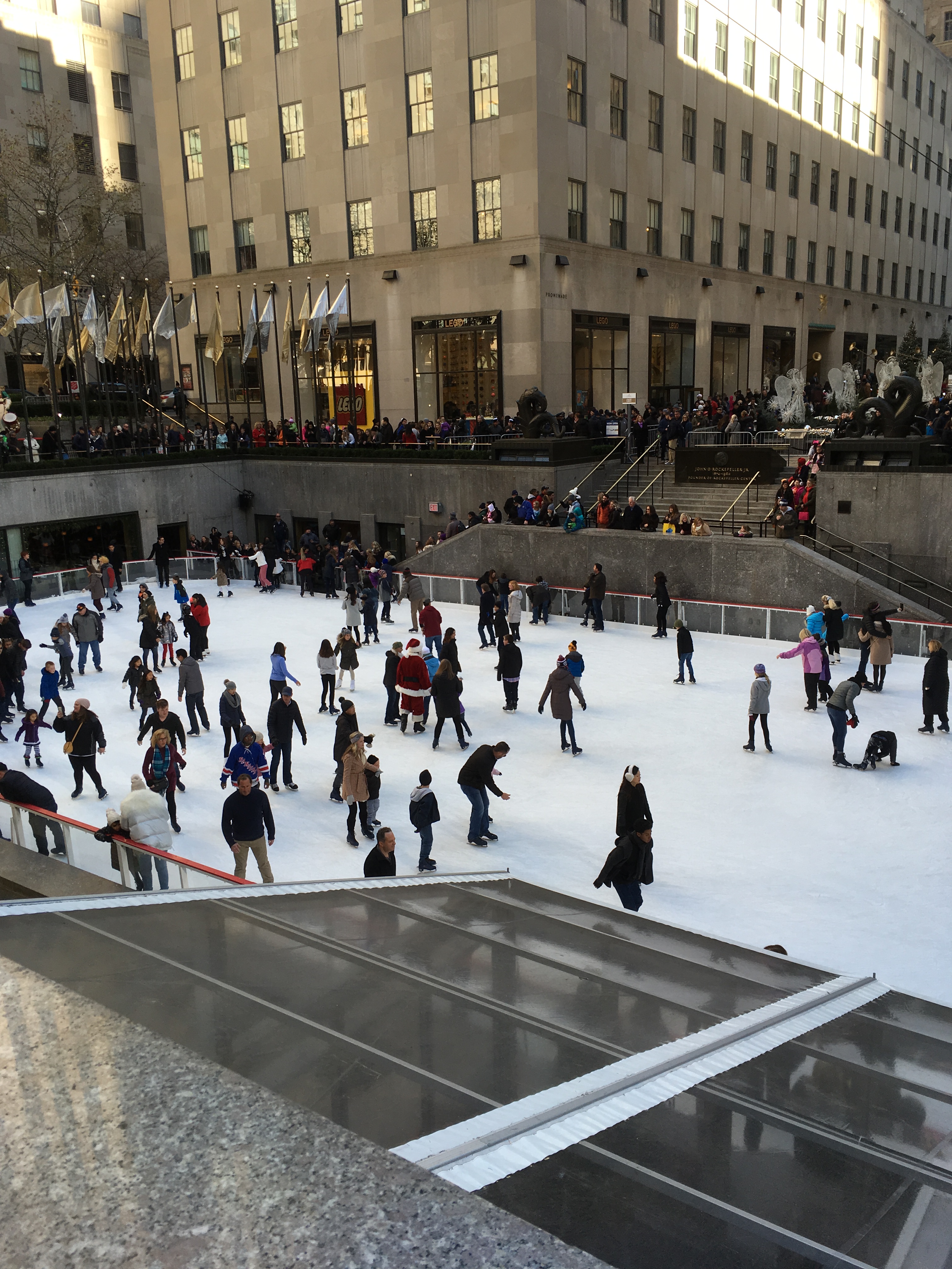 People skating outside 30 Rock